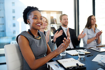 That deserves a round of applause. Shot of a group of corporate businesspeople applauding while...