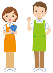 エプロンをつけた男女　介護士　スタッフ