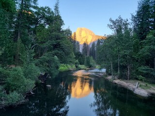 Sunset reflections of Half Dome in the Merced River, Yosemite Valley, California