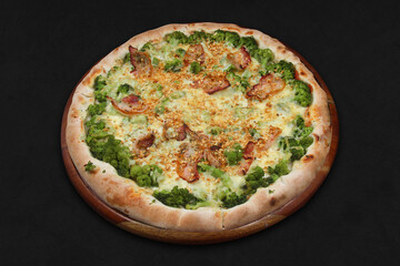 Broccoli pizza on black background