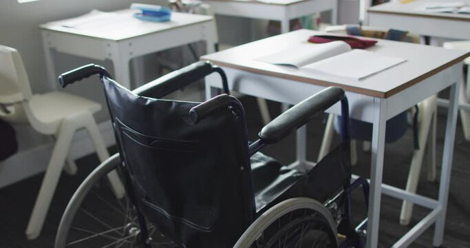 Video of empty wheelchair standing at desk in classroom