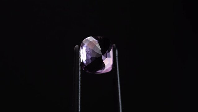 natural pink spinel gem stone on the turning table