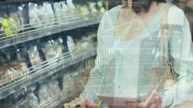 Animation of data processing over smiling caucasian woman with trolley in shop