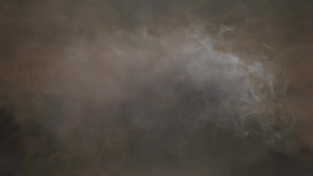 Animation of smoke moving over black background