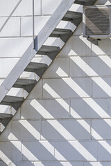 Obraz premium Fire escape on the background of the facade of the building