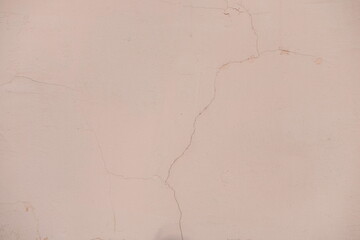 Antique plaster background. The wall of the house cracked.