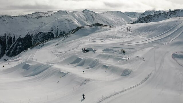 People snowboarding and skiing at ski resort