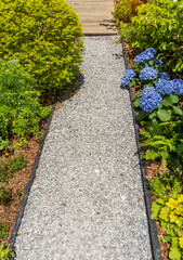 Fototapeta na wymiar path leading through a flower garden