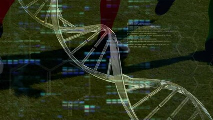 Animation of data processing and dna strand over diverse male soccer players playing at stadium - Powered by Adobe