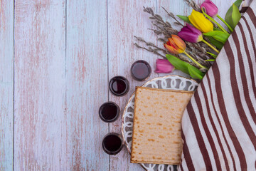 Jewish traditional Passover holiday celebration of kosher wine four cup and matzah bread on Pesach