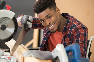disabled man using a handsaw