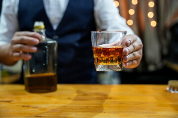 Bartender Serve Whiskey, on wood bar, 