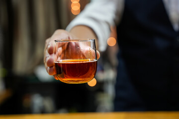 Bartender Serve Whiskey, on wood bar, 