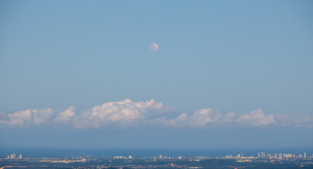 High Full Moon Over City Coast Line