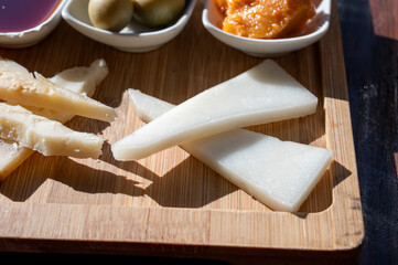 Dinner at guachinche, typical Canary Island establishment on Tenerife, where locally produced white or red wine served accompanied by homemade traditional food, tapas and goat cheese