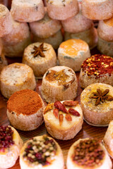 Variety of French soft goat cheese with different toppings, indian, curry, pepper, spicy