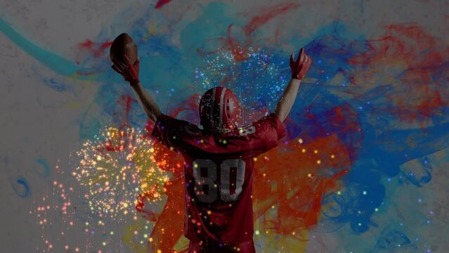 Animation of fireworks over american football player on colorful background