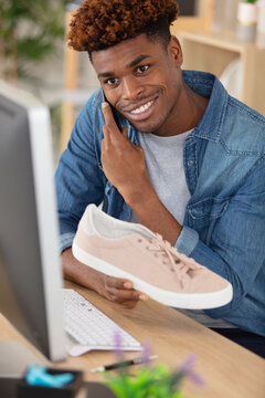 man using credit card to do shopping online with laptop