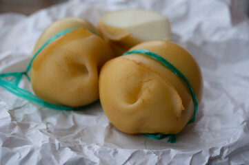 Italian cheeses collection, smoked scamorza pear shaped cheese from small cheese farm in South Italy