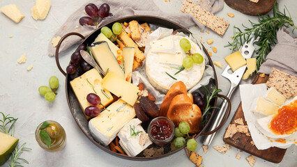 Cheese assortment on light background.