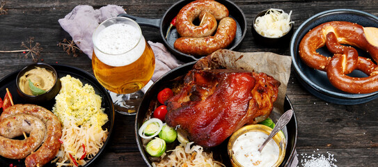 Grilled German sausages on wooden background.