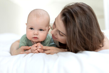 A woman with a small child. Mom with a baby. High quality photo