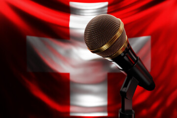 Microphone on the background of the National Flag of  Switzerland, realistic 3d illustration. music...