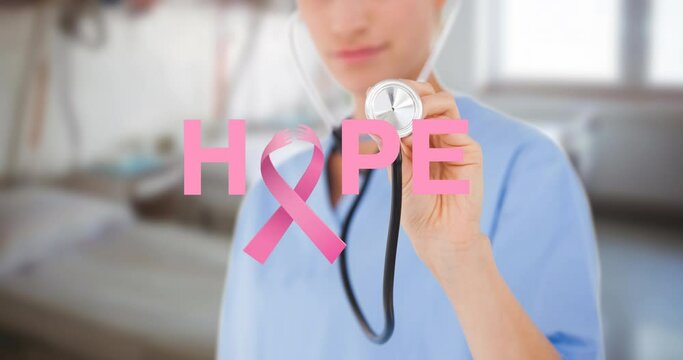 Animation of hope and breast cancer awareness ribbon and caucasian female doctor with stethoscope