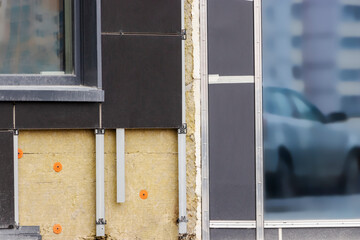Power saving technology: plates of mineral wool on the side wall, between the metal profiles for...