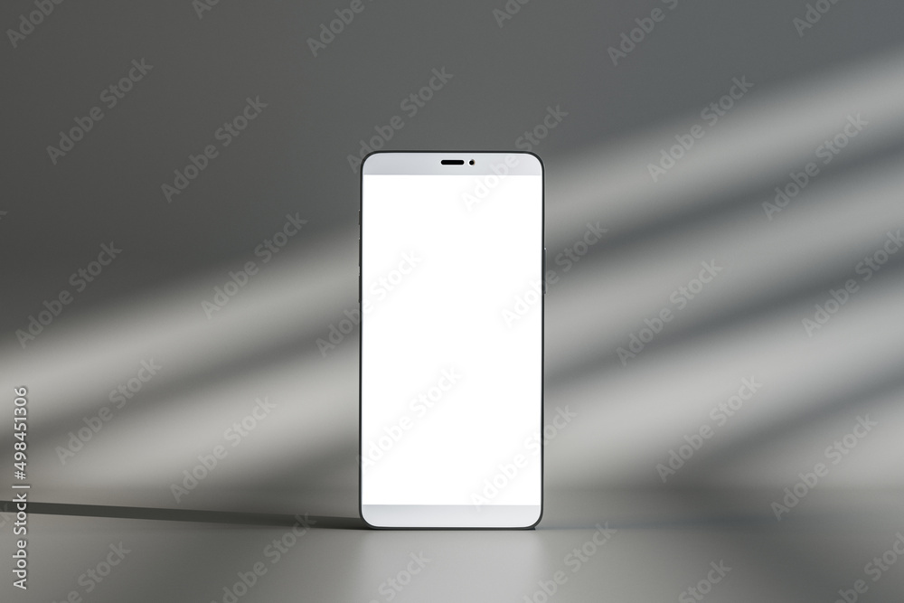 Aufkleber close up of empty white mock up screen cellphone on gray wall background with sunlight. product devi