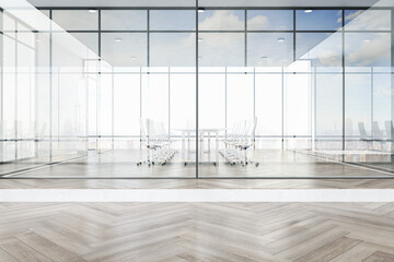 Luxury glass office interior with city view, daylight, furniture and wooden flooring. Workplace concept. 3D Rendering.
