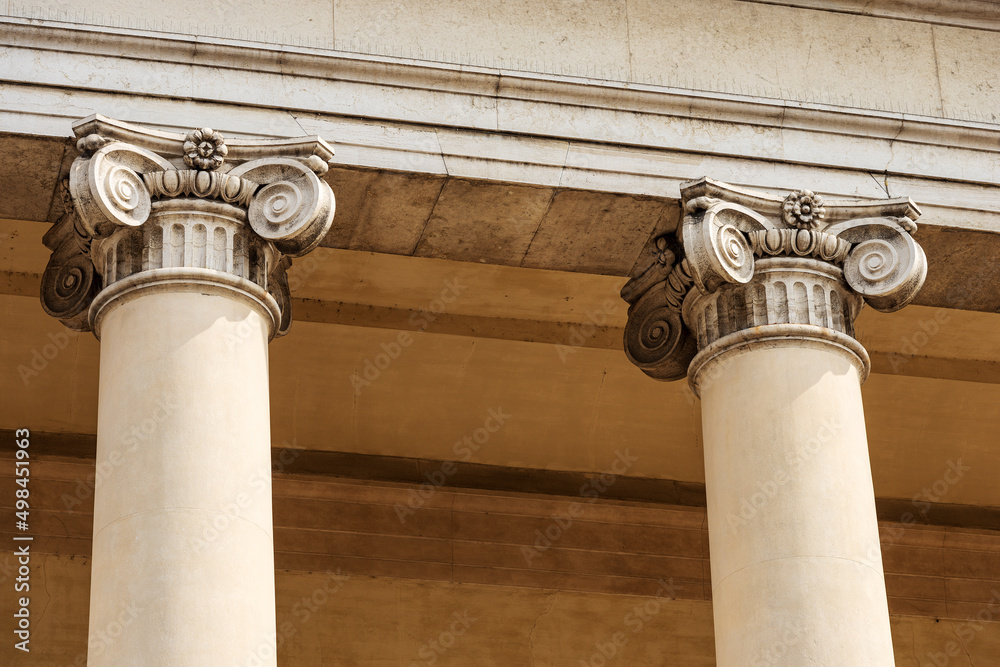 Wall mural close-up of two columns with ionic capitals. facade and pronaos of treviso cathedral (duomo o catted