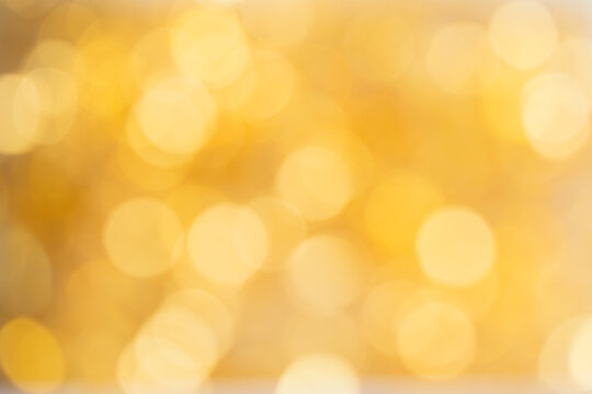 Many golden bokeh background. Abstract image for design.