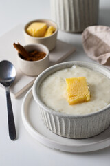 Close up of ceramic bowl with Norwegian rice porridge or risgrot .