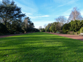 Obraz na płótnie Canvas Grass field in park and blue sky