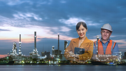 Fototapeta na wymiar Double exposure, Asian businesswoman holding tablet waering brown suit and Smiling male engineers caucasian with their arms crossed wearing a safety helmet (hard hat) with Petrochemical refinery.
