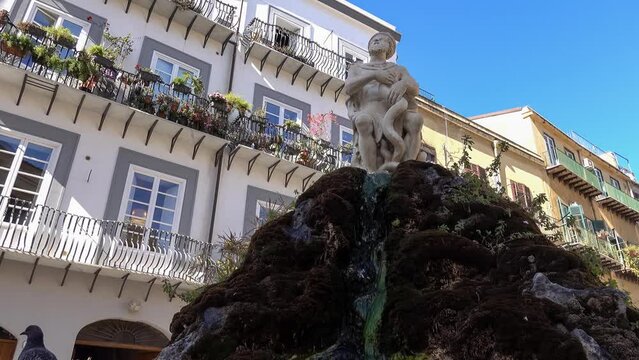 Genius of Palermo statue (Statua del Genio di Palermo) in Italy with a fountain