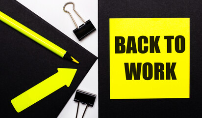 On a black background, a bright yellow pencil and an arrow and a yellow sheet of paper with the text BACK TO WORK.