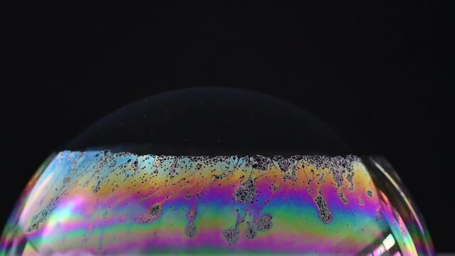 Rainbow-colored surface of soap bubbles