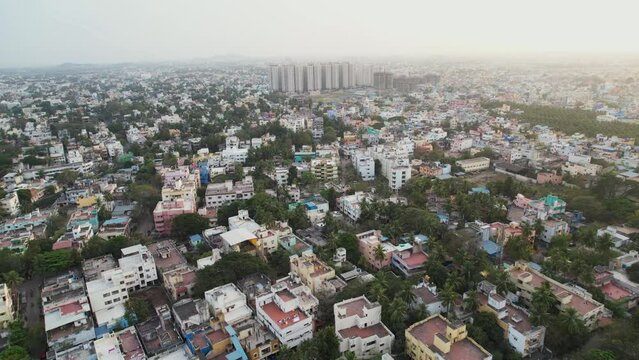 Aerial view of CHENNAI city which shows tall buildings in the heart of the city with construction of new buildings and vacant land.