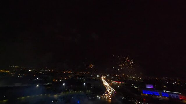 Night Sky Spectacular Drone FPV Shot Flying into Exploding Skyrockets as part of Fireworks Display Independence Day Event, Dominican Republic