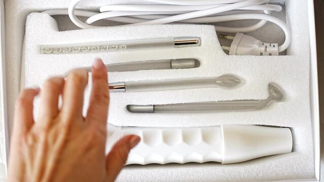 New electric Darsonval in white box in beauty parlor