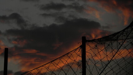 wire fence at sunset