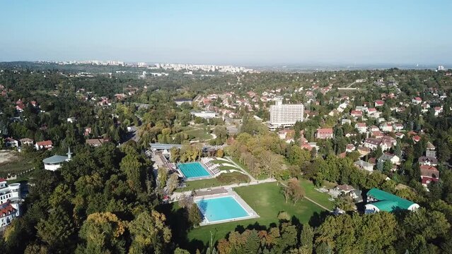 Cinematic 4K aerial drone footage of the Thermal Cave Bath, hot springs of Miskolctapolca with views of Miskolc a regional center of Hungary, capital of Borsod-Aba&uacute;j-Zempl&eacute;n county