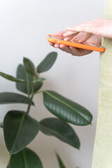 E-commerce in small business. Florist sells flowers via the Internet, close-up. Ordering a gift bouquet via messenger, remote delivery