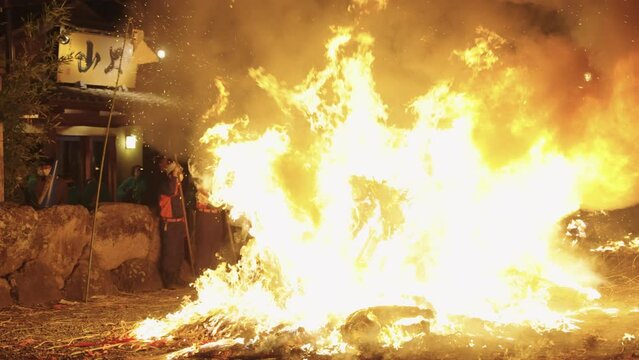 Blaze burning in the night, Huge bonfire erupting at Sagicho Matsuri