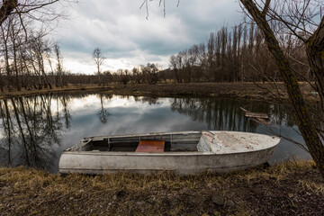 Lake landscape with boat in the Botanical garden in Chisinau, Moldova
