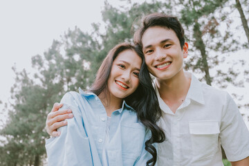Naklejka premium Portrait of young Asian couple outside