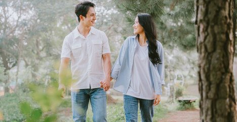 Portrait of young Asian couple outside