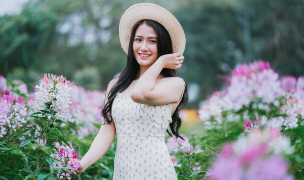 Portrait Of Young Asian Woman At Flowers Field